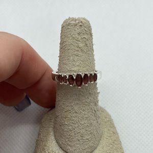 Ladies adjustable lab created garnet marquise cut silver tone ring size 6-8.